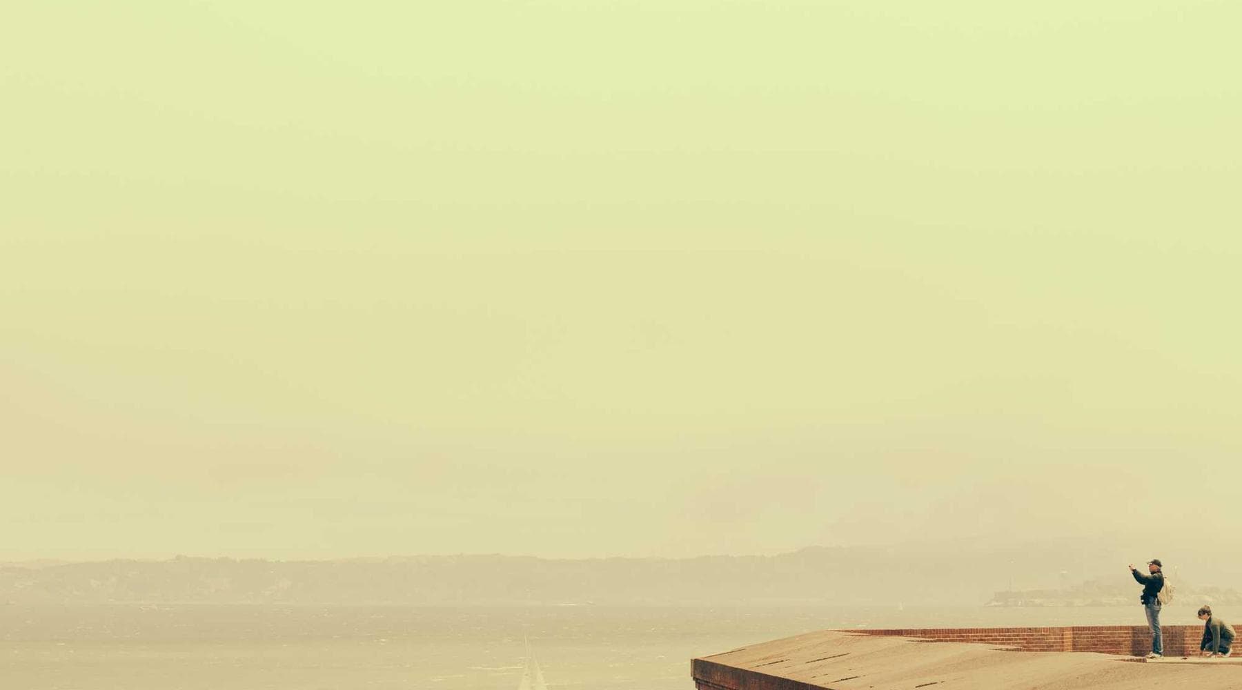 Wide landscape shot of a misty mountain range