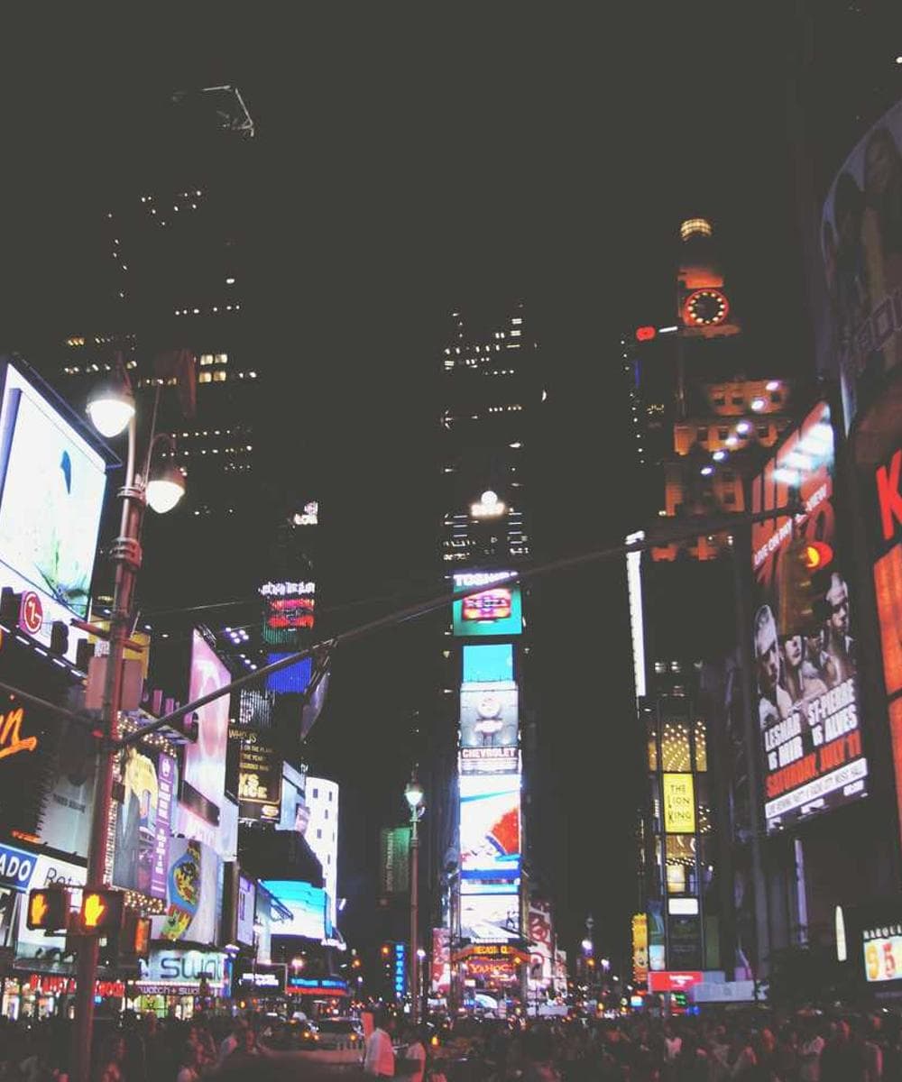A potter's hands shaping clay on a wheel