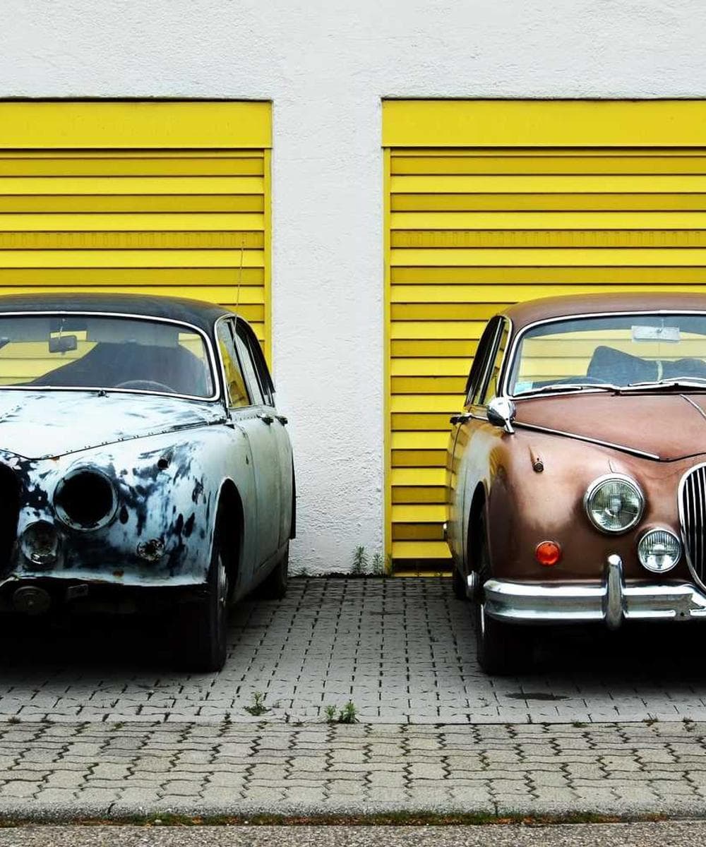 A close-up of a marble countertop with minimalist black fixtures