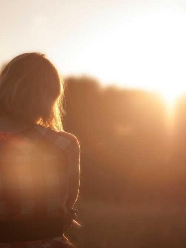 An old film camera on a stack of books